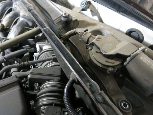 The electrical plug is tricky to remove because you have to depress under the plug to remove the electrical plug.  Once the electrical plug is removed and removed from the bottom metal tray, there are 5 10 mm screws to unbolt the windshield wiper motor.  