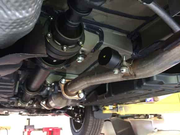 Exhaust damper mounted mid-pipe on Lexus.