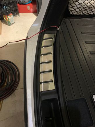 I keep trickle charger connected and in back of trunk at all times. When using I string charger wiring out of trunk