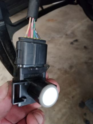 New sensor (no paint) plugged in and ready for installation.