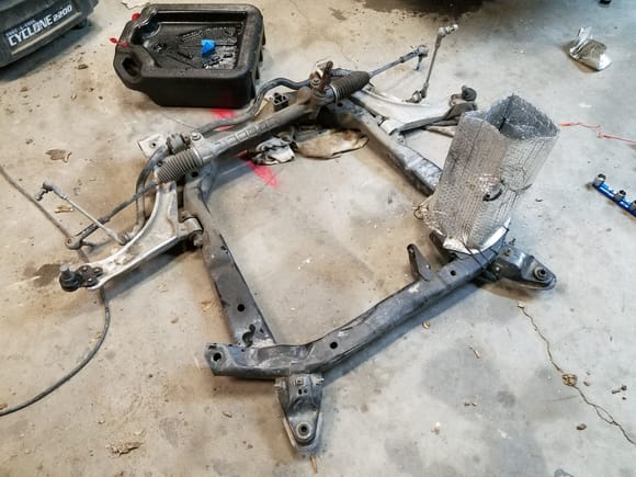 Subframe is out with front suspension components removed and everything else getting ready to drop the transmission for Quiafe LSD install this evening.