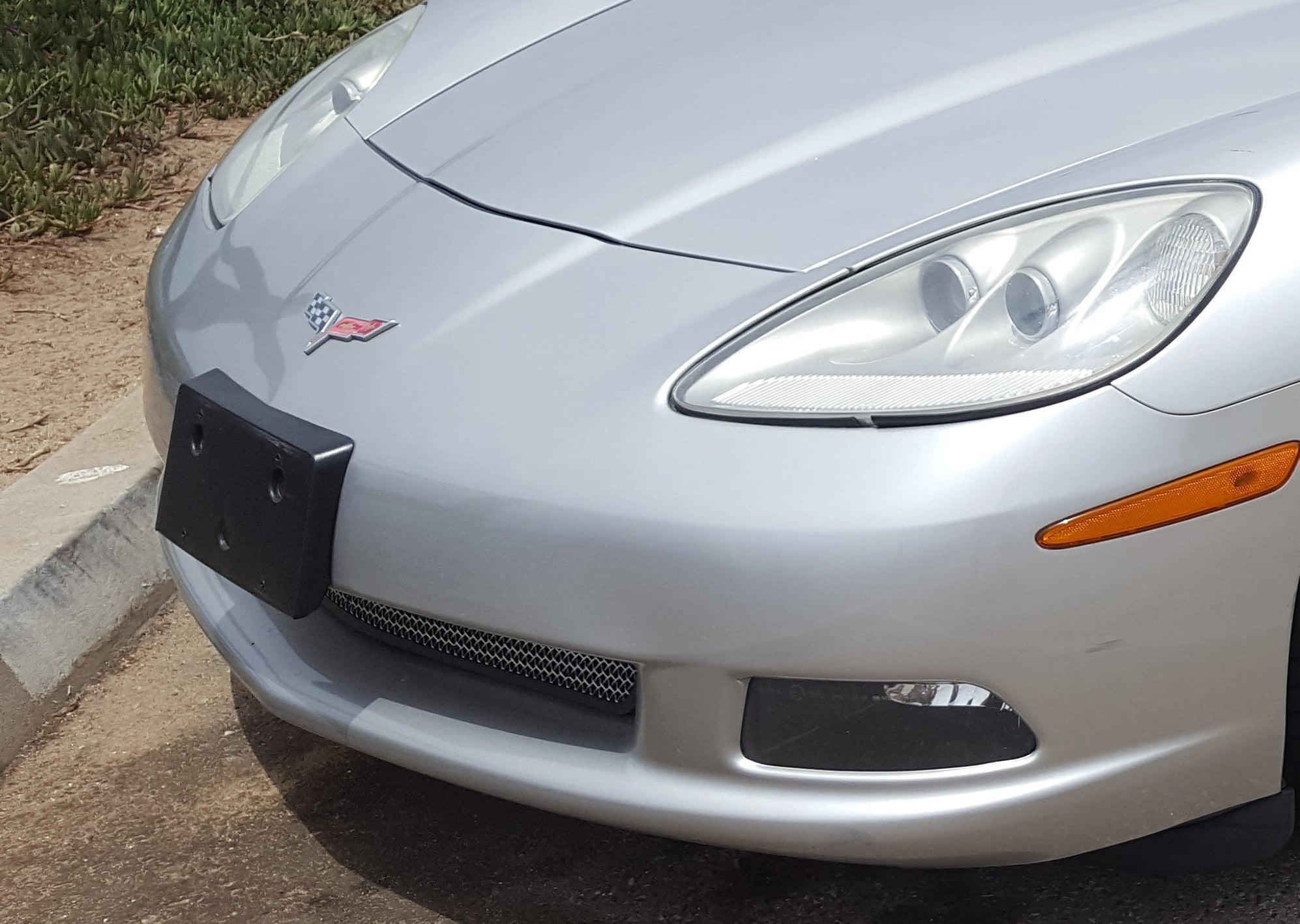remove c6 corvette front license plate bracket