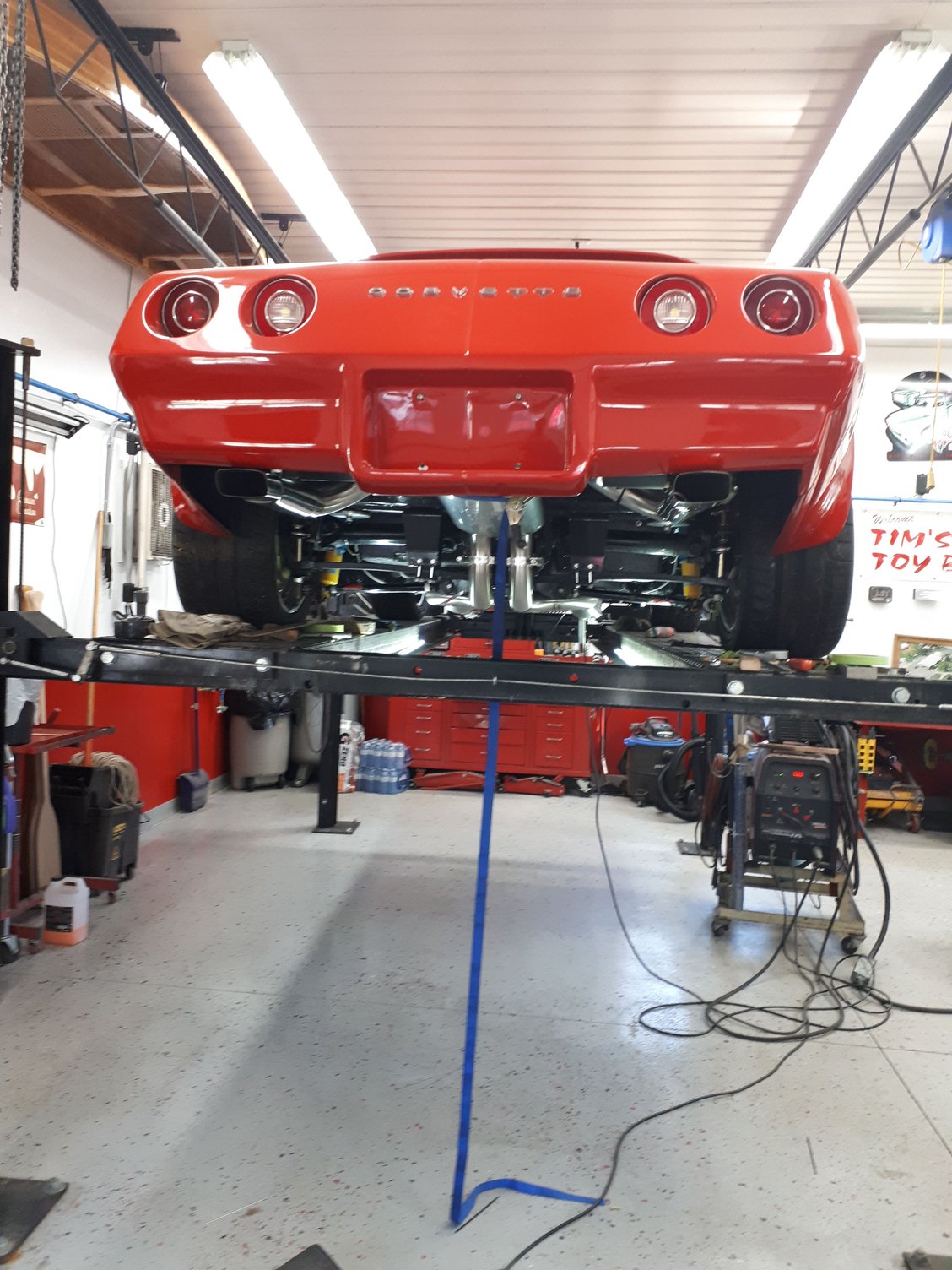 At my buddies garage installing the exhaust. 2.5 in sanitary stainless pipe through a borla pro xs muffler