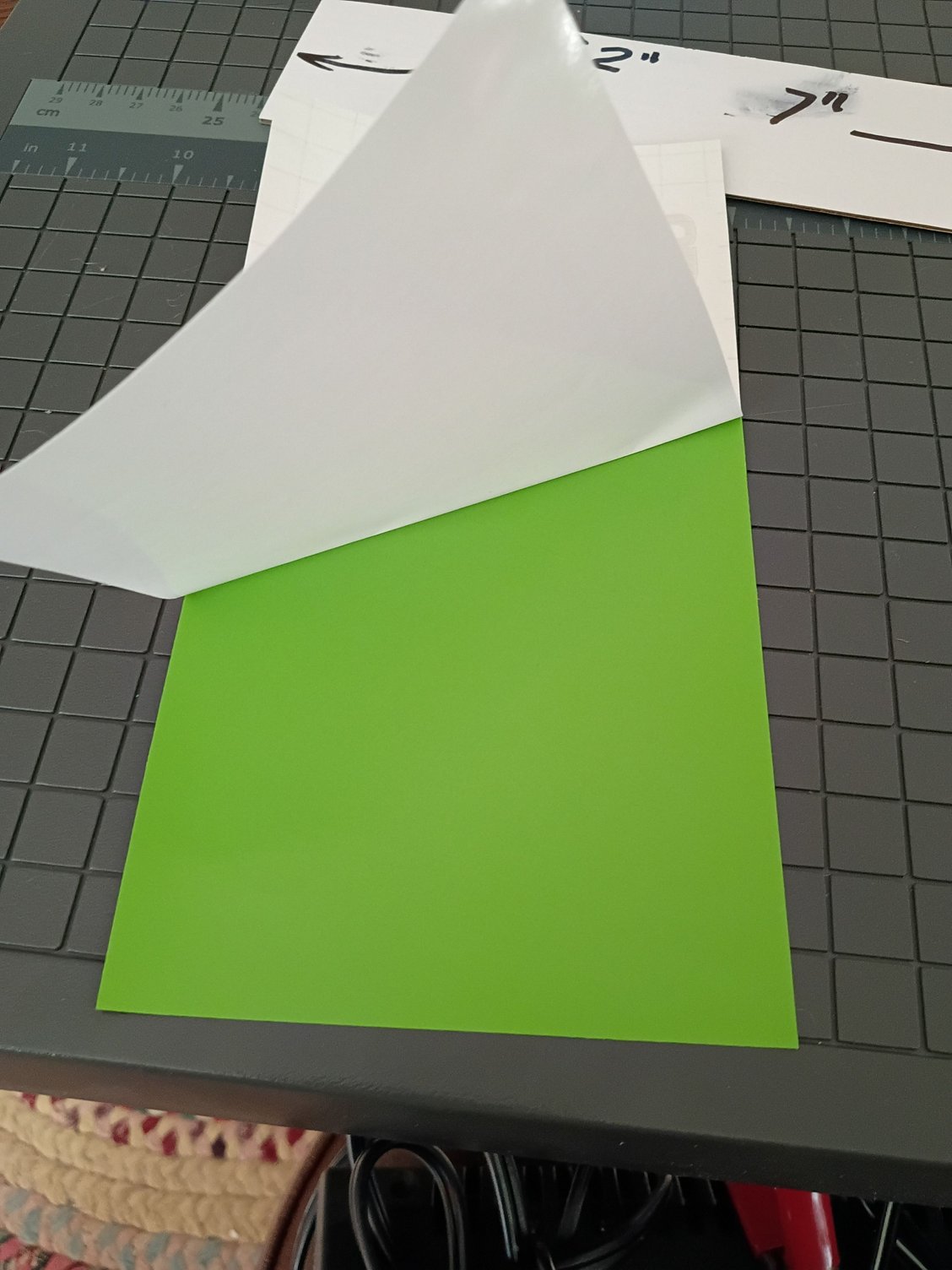 Peel backing from vinyl