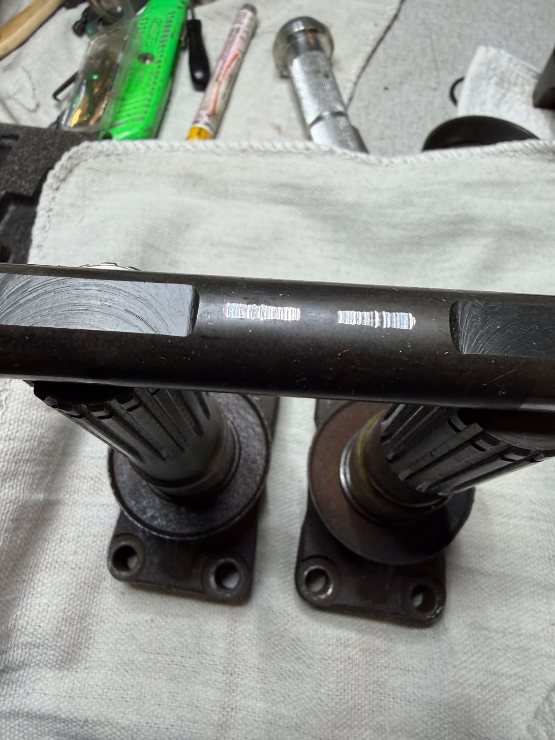 Cross shaft showing wear pattern from the other axle.