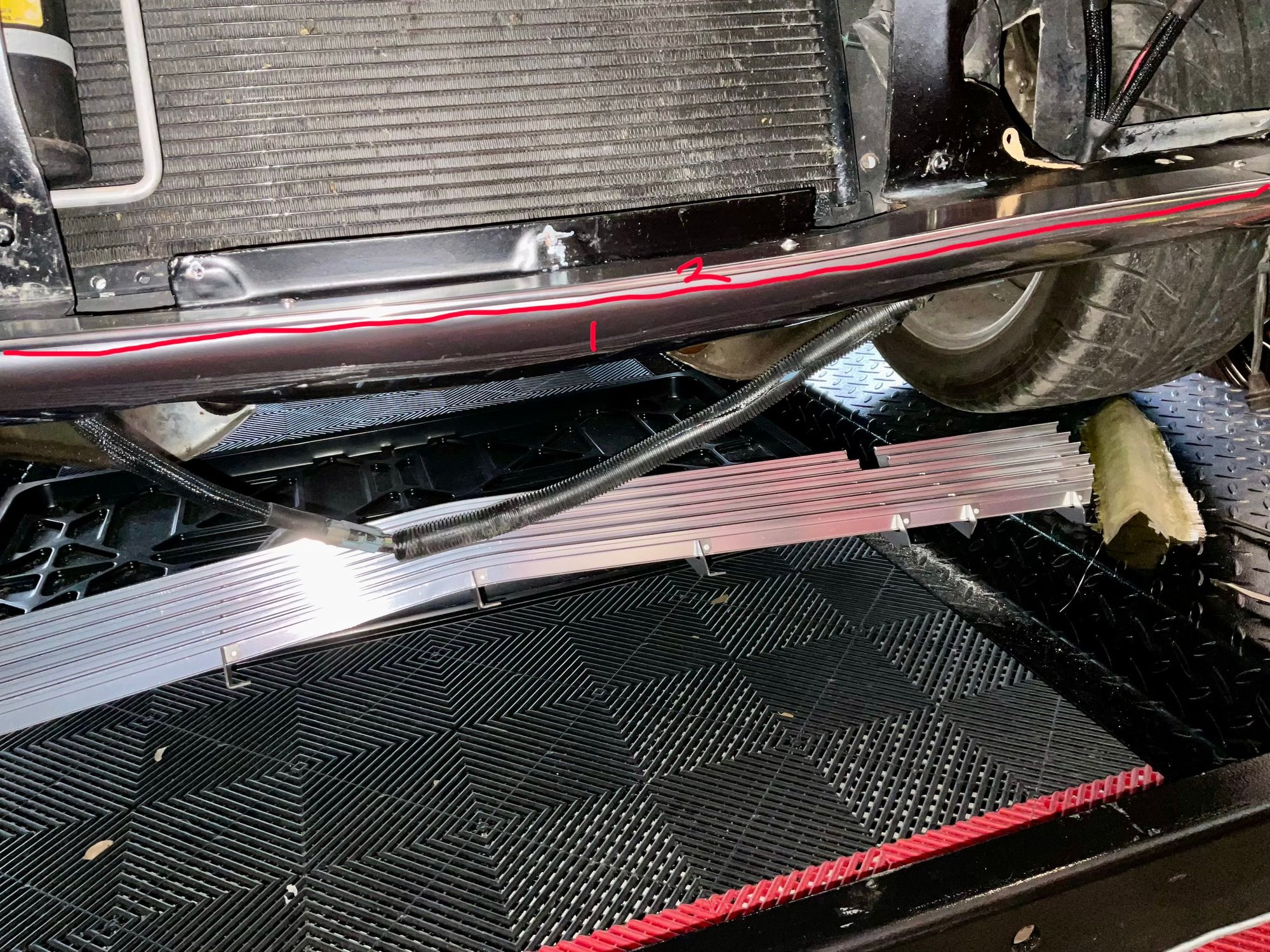 Start with the lower valance #1. It is the easiest piece and will help you as you progress to the more difficult. Remember to wrap it up and around the parking light pods as shown in the next picture. You will need to stretch the material a bit.