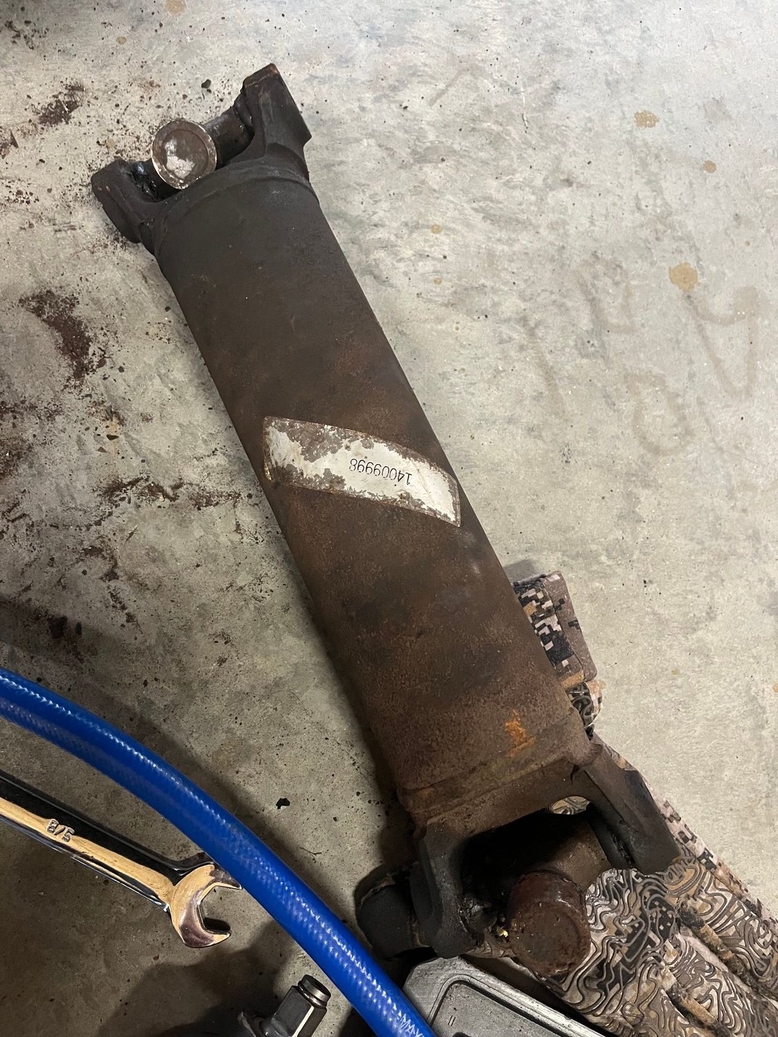 Pulled the half shaft. Got the wheels turning.  Ended up being a part of the parking brake assembly was hung up!  