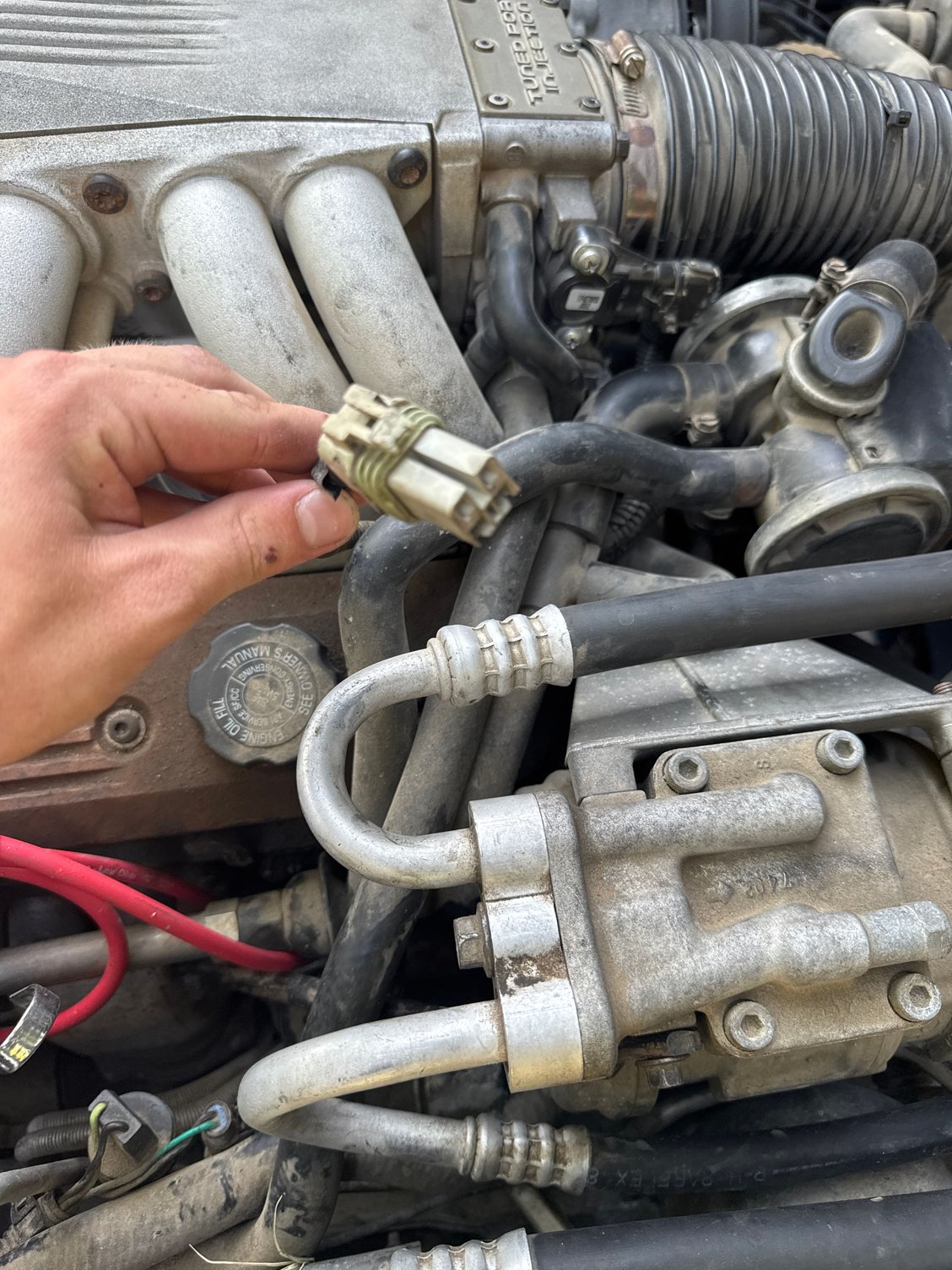 My a/c is not working I have a 1988 I have this loose connector that I believe powers my ac compressor but I have no where to plug it in???