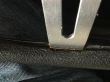 The brown stuff is “leaking” on the front and back side of the metal spoke