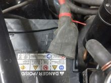 Bicycle tube cut to fit the terminal with a hole for the battery post. Additional protection.