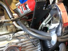 Driver bracket is the first bolt from the firewall on Edelbrock Manifold