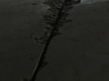 This is a saw cut inside the shop that is chipping away from heavy metal wheels rolling over them