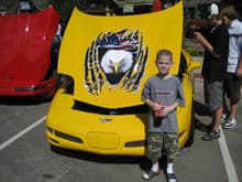 Mason at Vettes on the Rockies 2008 - His favorite car with the eagle on the hood.