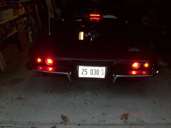 Infused LEDs in outer brake lights and Superbrite red LED bulbs in backup light positions for brake only. Both brighter than 1157