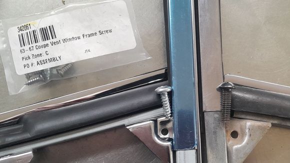 reproduction screw on left, no threads in hole. The vent window from my car has black bolt threaded in.
