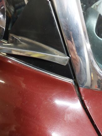 Gap at the windshield trim. Considering a rubber spacer glued to the bracket to prevent movement forward if it comes forward in use.