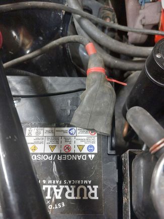 Bicycle tube cut to fit the terminal with a hole for the battery post. Additional protection.