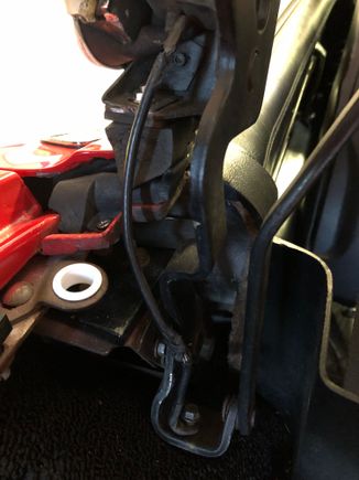 The bottom ring is attached by a bolt inside the frame