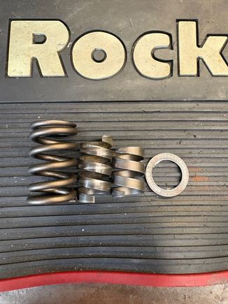Valve spring, new damper, old damper, & spacer.
