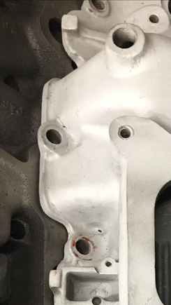 There is a small crack in the manifold coming out of the bolt hole pictured