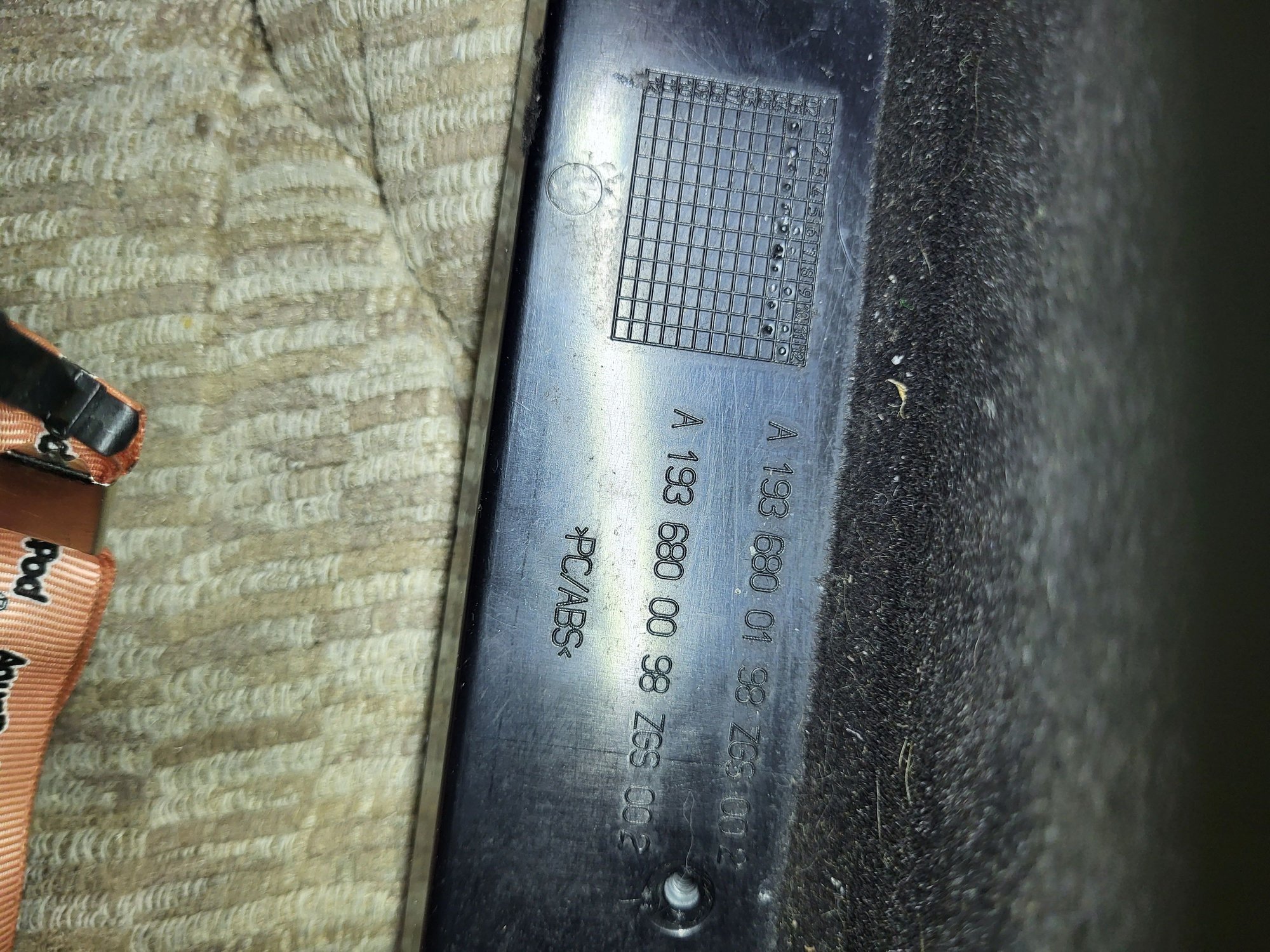 Full view of back edge of glove box door.