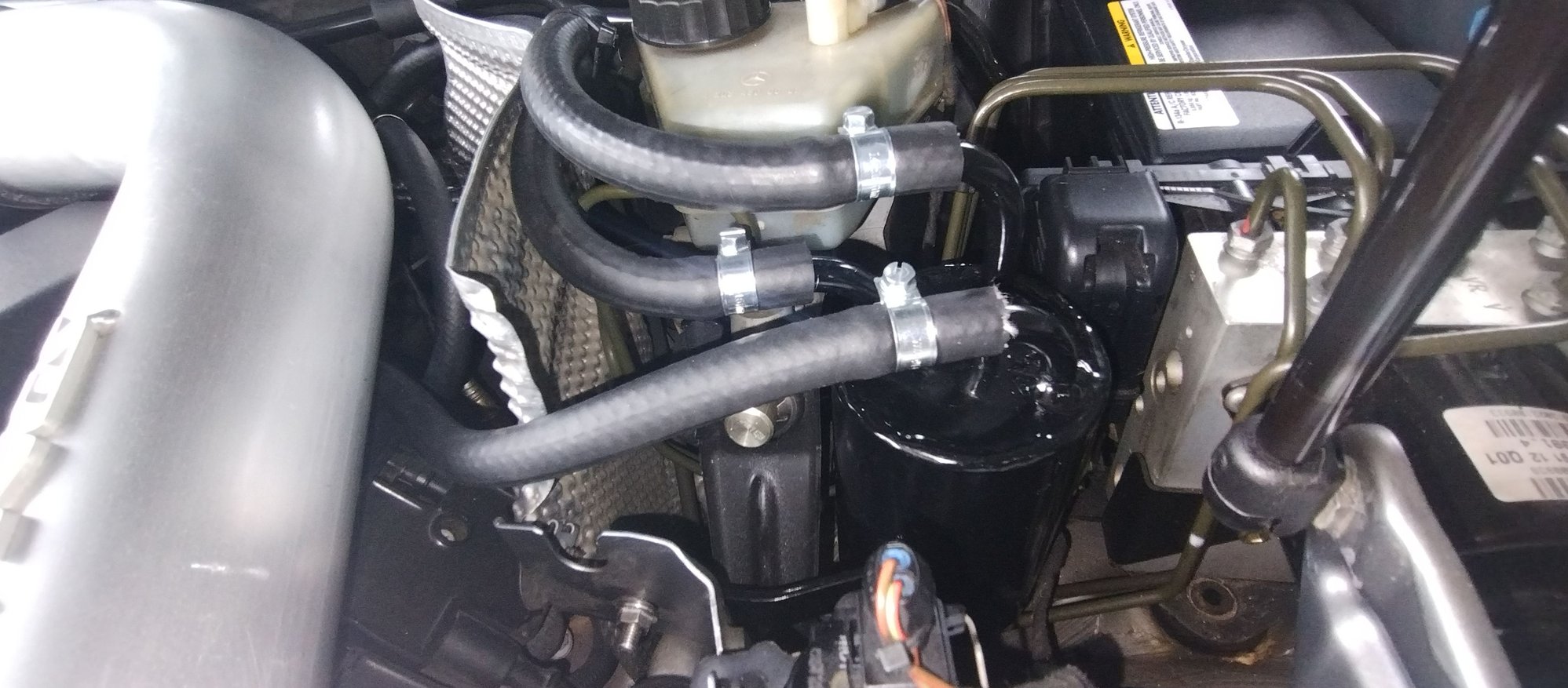 Picture top-to-bottom tubing. Top tube: passenger valve cover connection. Middle tube: drivers valve cover connection. Bottom tube: Y-shaped throttle body connector (drivers side). Passengers side, use the plug provided to block it.