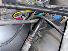 Passenger side where yellow wire spliced into harness’ brown wire 
