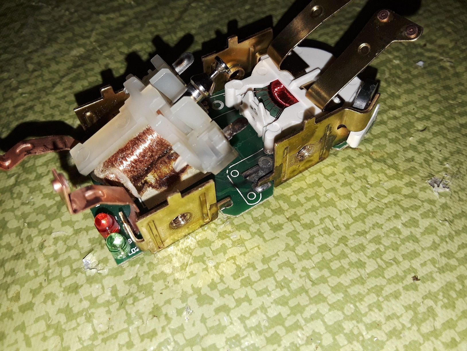 What could cause a GFCI to fail this way? Pictures included