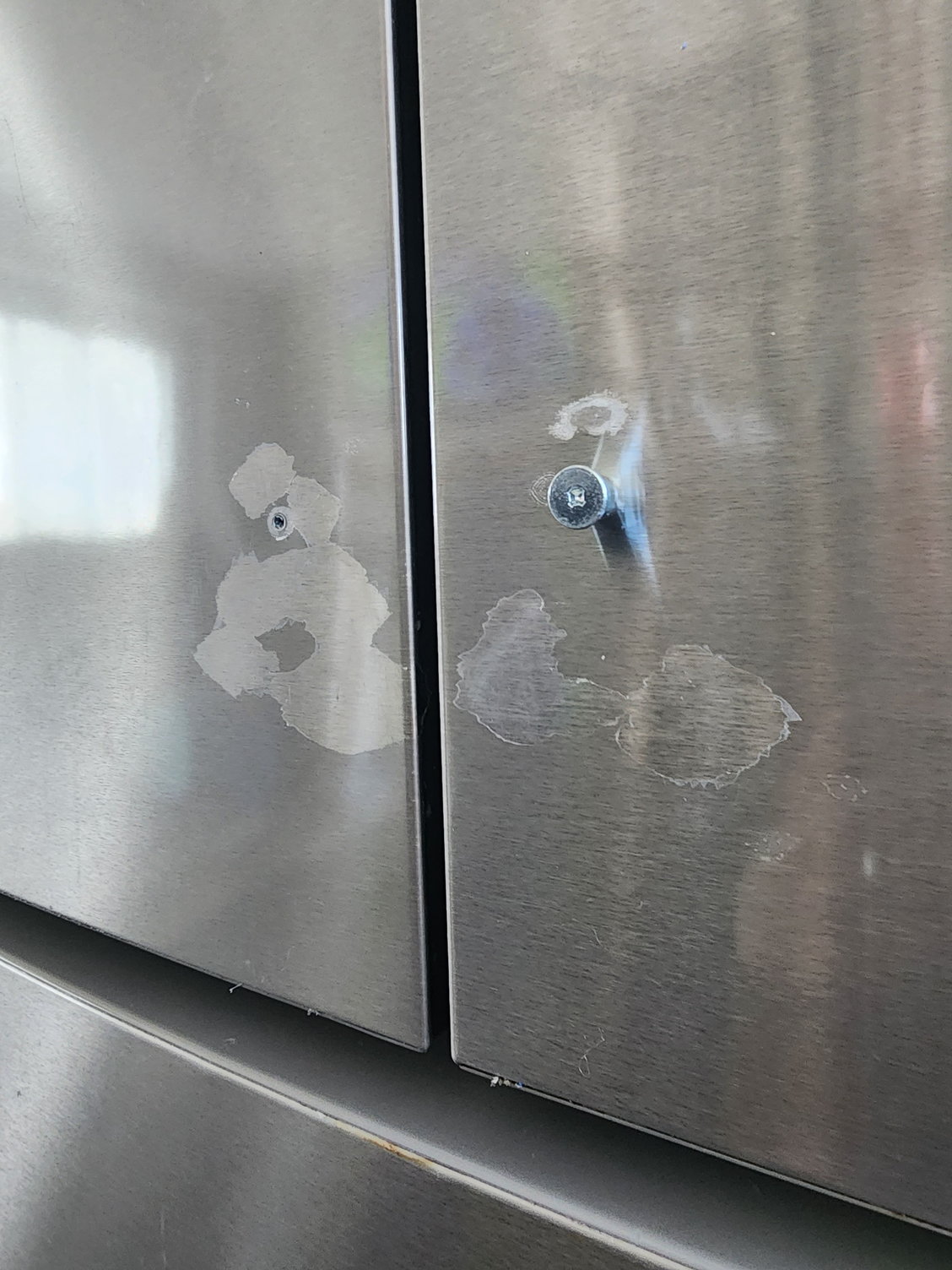 Remove protective film glue from SS fridge front