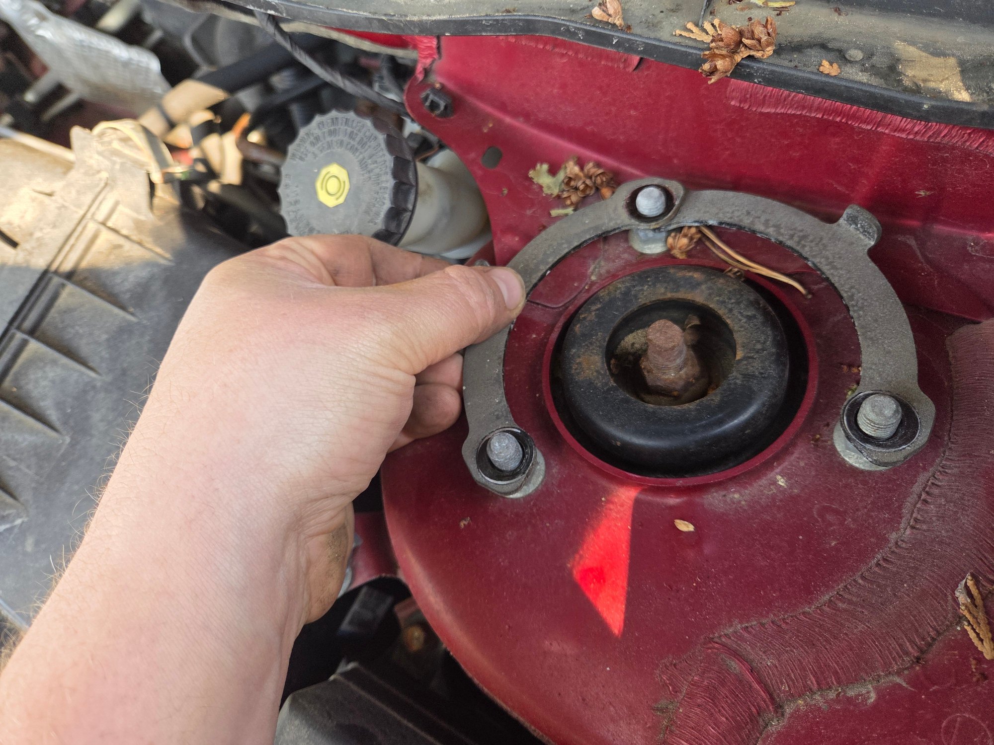 These are the strut tower spacers off the sonata. Same bolt patern as the OS. Unfortunately the sonata struts have a forked bottom attachment point like the 2nd gen eclipse. Im wondering if i could possibly swap the top hats of the sonata struts onto my evo struts but they might have clearance issues even if that could work. The sonata spacers were probably 2cm closer together than my evo's strut tower bolts