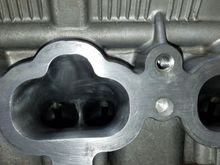 Inside the cylinder head intake side.