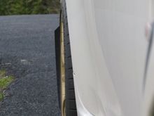 passenger side, point from front of car to rear to show the *poke* of rear tire.. just about flush.