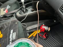 Fishing tape used to feed speaker wire into door.