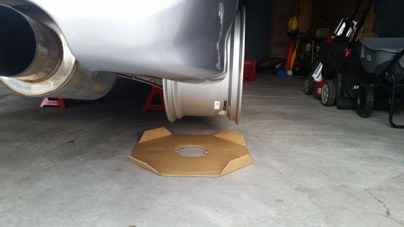 Suspension is fully flexed out without coil overs on car thus wheel sticking out this much.