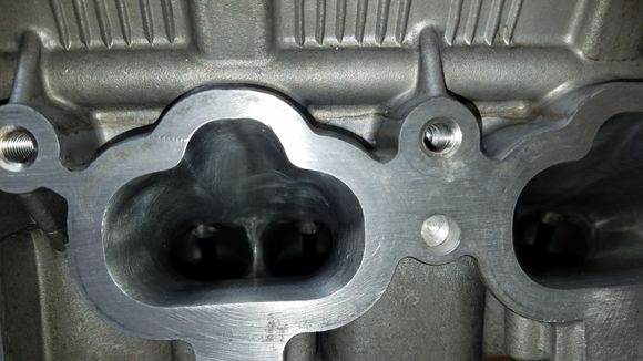 Inside the cylinder head intake side.