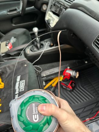 Fishing tape used to feed speaker wire into door.