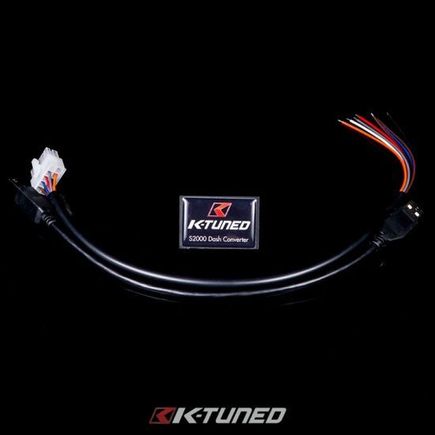 K-tuned dash converter.

Straight from the advertisement: "The K-Tuned All-In-One S2000 Dash Converter was designed to take the all the guesswork and headaches out of the very popular S2000 cluster swap. This simple, easy to use and programmable converter, allows the user to make adjustments to 3 separate functions: Speed, Coolant Temp, and Fuel Level. The unit can be used with both the AP1 and AP2 S2000 gauge clusters in just about any chassis."