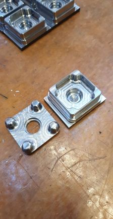 Old Rev1 design versus Rev2 design. Rev two is faster to machine and has less burrs that needs to be worked. Overall a better piece.