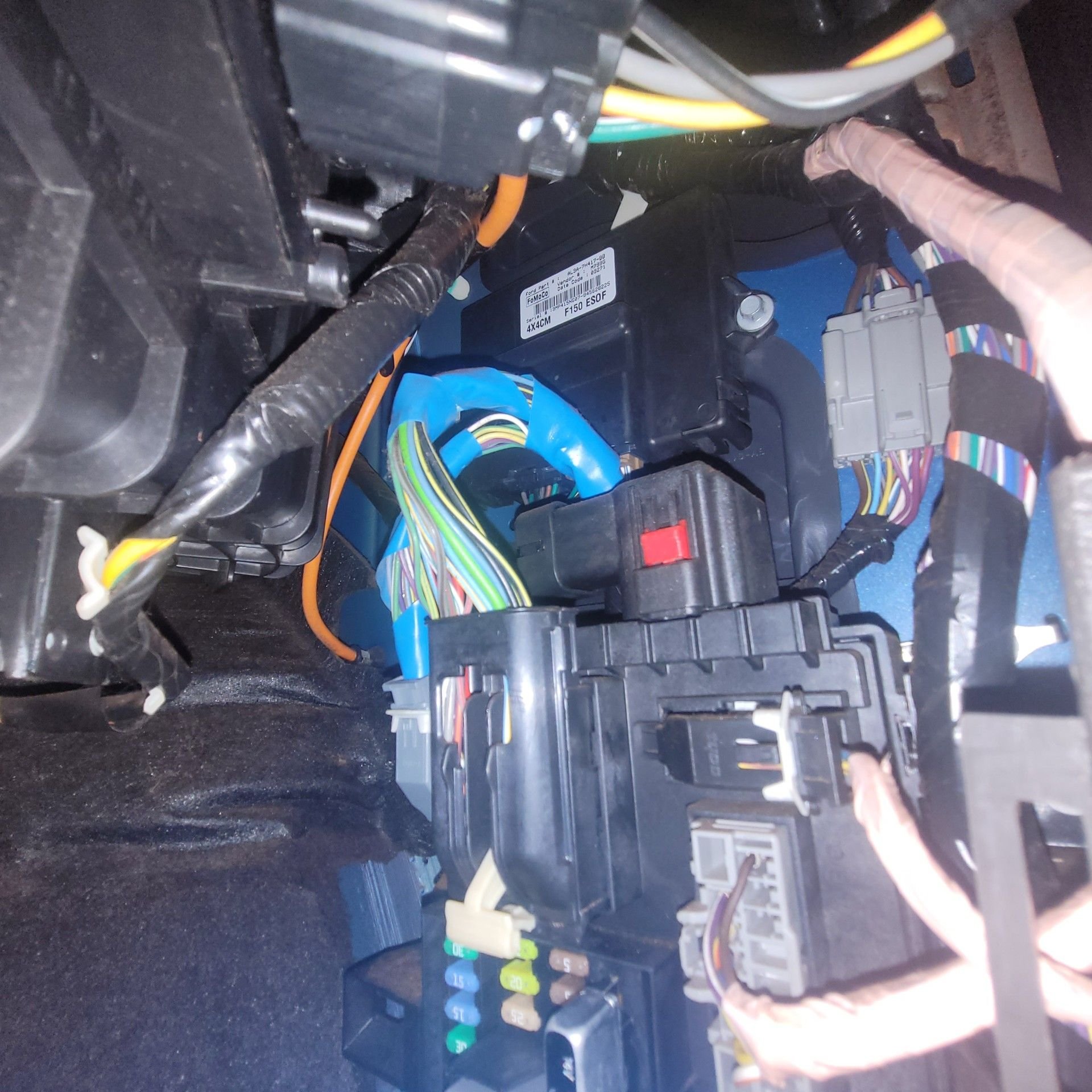 That red cable appears to go to that connector with the red tab on it , can it be pulled out ?