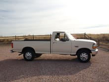 94 F250. XL 5.0, 5spd. Colonial White with Mocha interior trim.  Knitted vinyl bench.  Completely stock, original.  Born at Norfolk,  VA truck plant.