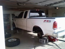Truck on stands and no tires..