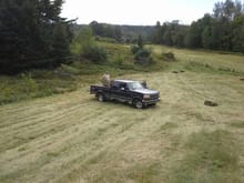 Gathering square Hay bales from our second cut.