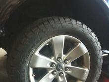 Testing out a Nitto Grapler 285/55/R20

Should I get 305/55/R20 instead if I want a more aggressive look? Will this particular size work with my truck?