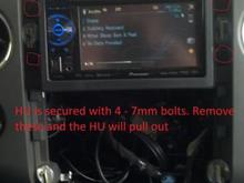 The HU is secured with 4 - 7mm bolts.

Remove the bolts and Pull the HU out of the Dash.