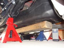 lowering and moving gas tank inboard about 3" each direction to get the leaf spring bolt out, after trimming 3/4" off the tapered end of the bolt.