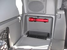 Maglite mounting location inside the rear storage cubby.