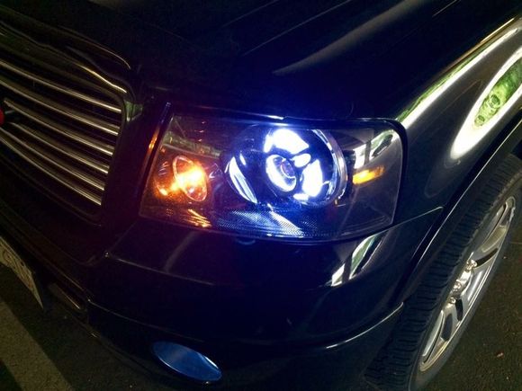 Can't find all of my photos. Hids are off in this pic. That is a switch back halo ring. It goes from white to Amber. 
Hids are 5000k. Not blinding