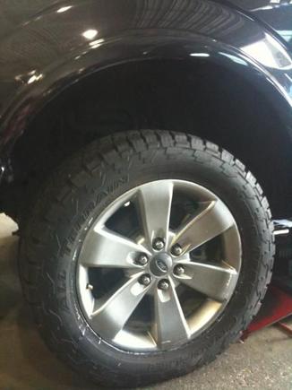 Testing out a Nitto Grapler 285/55/R20

Should I get 305/55/R20 instead if I want a more aggressive look? Will this particular size work with my truck?