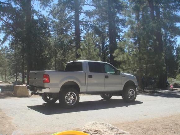 6" ProComp lift, 20" moto metals, 35" Dick Cepek all terrains, Air Raid cold air induction, 3" Gibson exhaust, Smoke colored LED tail lights and 3rd brake light, Limo tint all around except the passenger and drivers windows, 7" Pioneer in dash tv screen, 10 JBL sub, 700w Pioneer amp, new pioneer speakers x4 doors, Air Lift leveling assist airbags and auto compressor.  4 KC Slimlights on the front