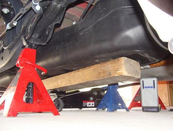 lowering and moving gas tank inboard about 3" each direction to get the leaf spring bolt out, after trimming 3/4" off the tapered end of the bolt.
